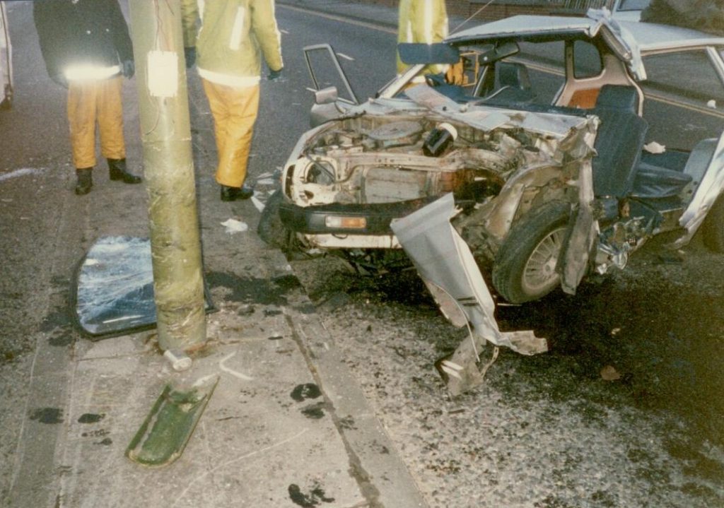 The front of the completely wrecked car in June 1989 that Clive, Jess and their friends were in and the lampost that was hit.
